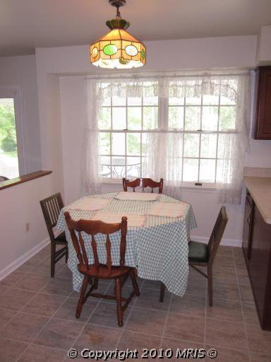 Kitchen Remodel. See how this 1980's kitchen gets some traditional farmhouse kitchen style in this kitchen remodel. See how paint transforms the kitchen cabinets and takes this kitchen from 80's oak to amazing.