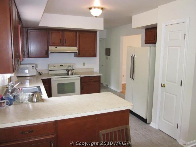 Kitchen Remodel. See how this 1980's kitchen gets some traditional farmhouse kitchen style in this kitchen remodel. See how paint transforms the kitchen cabinets and takes this kitchen from 80's oak to amazing.