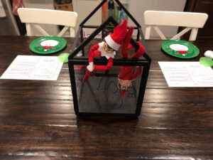 This shows an example of an elf on the shelf arrival. The elves are present as well as their elf return letter free printable.