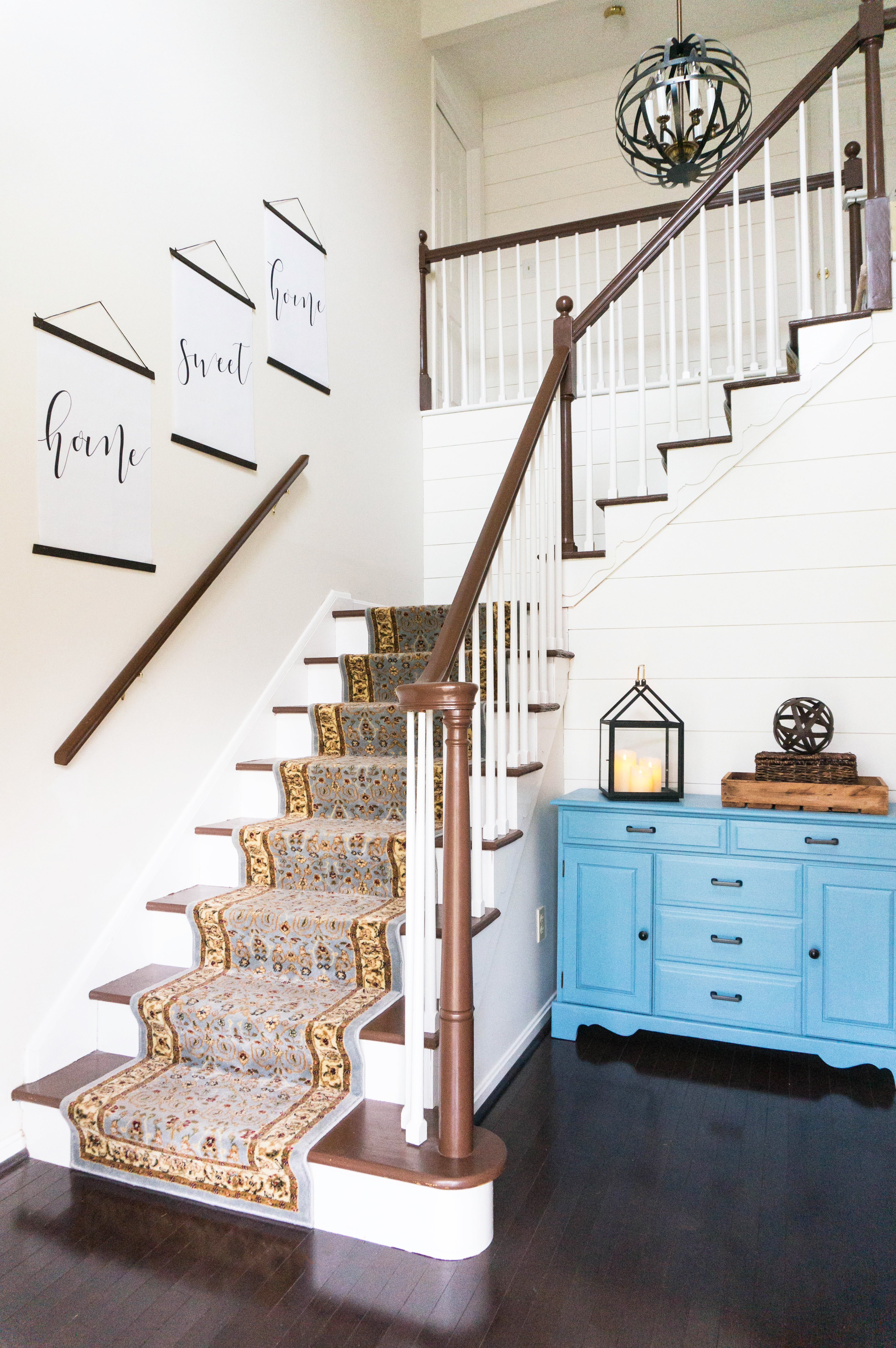 Inexpensive entry remodel reveal. Find out how our farmhouse foyer turned out. Our fixer upper foyer needed a major redo. See how we rennovated our foyer on a budget. #farmhousedecor #farmhouse #fixerupper #foyer #entryway