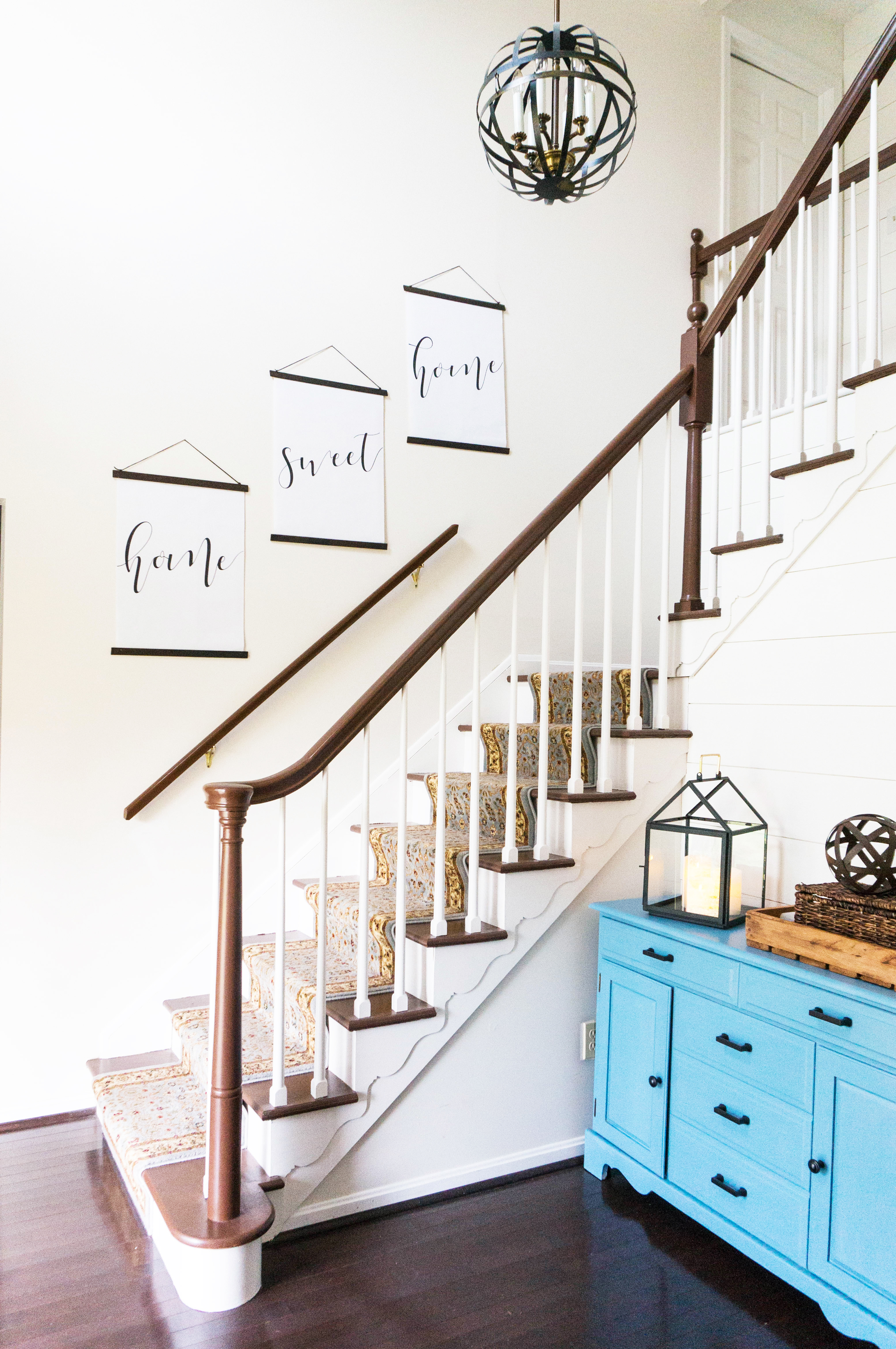 Inexpensive entry remodel reveal. Find out how our farmhouse foyer turned out. Our fixer upper foyer needed a major redo. See how we rennovated our foyer on a budget. #farmhousedecor #farmhouse #fixerupper #foyer #entryway