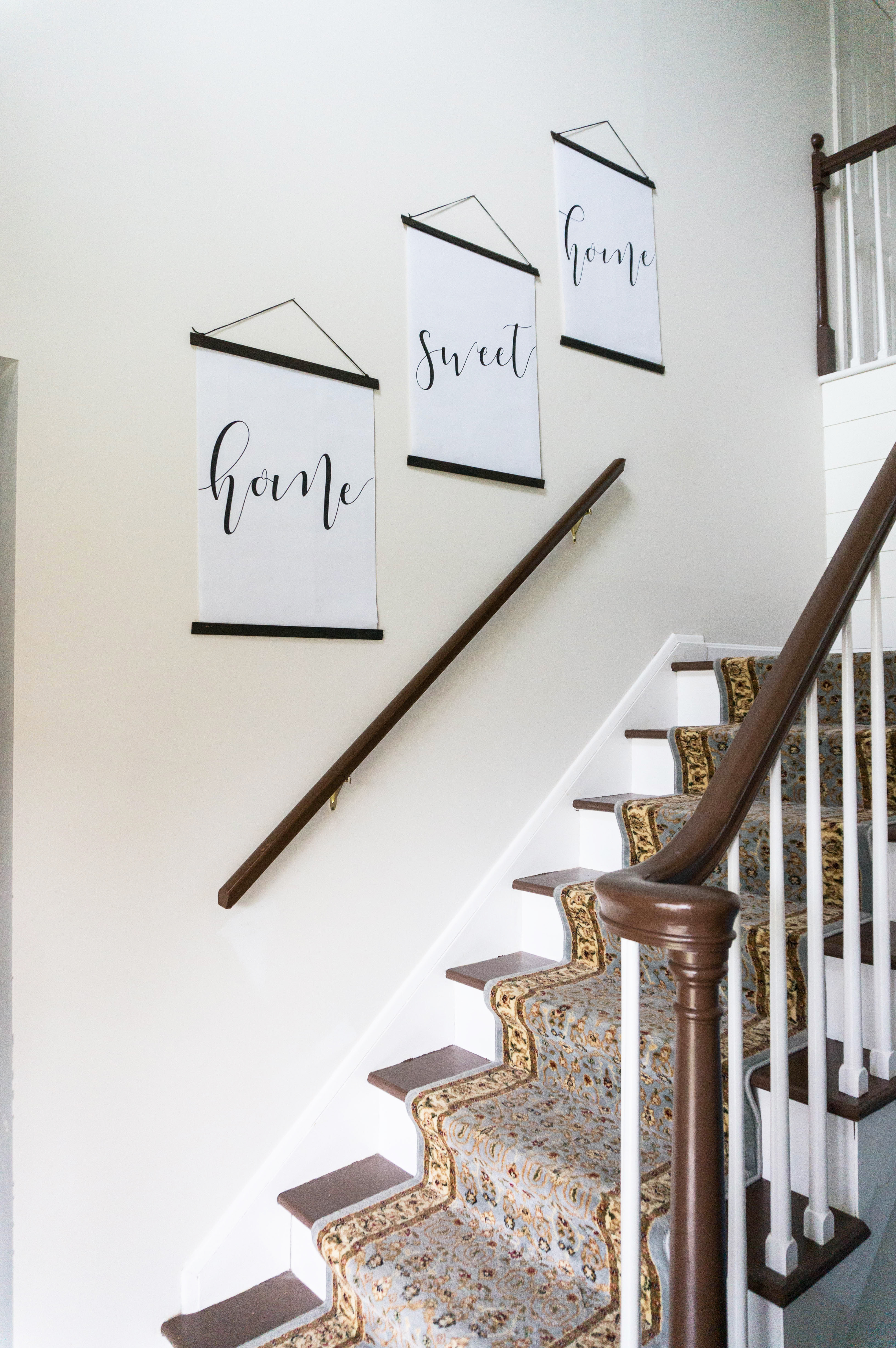 Inexpensive entry remodel reveal. Find out how our farmhouse foyer turned out. Our fixer upper foyer needed a major redo. See how we rennovated our foyer on a budget. #farmhousedecor #farmhouse #fixerupper #foyer #entryway