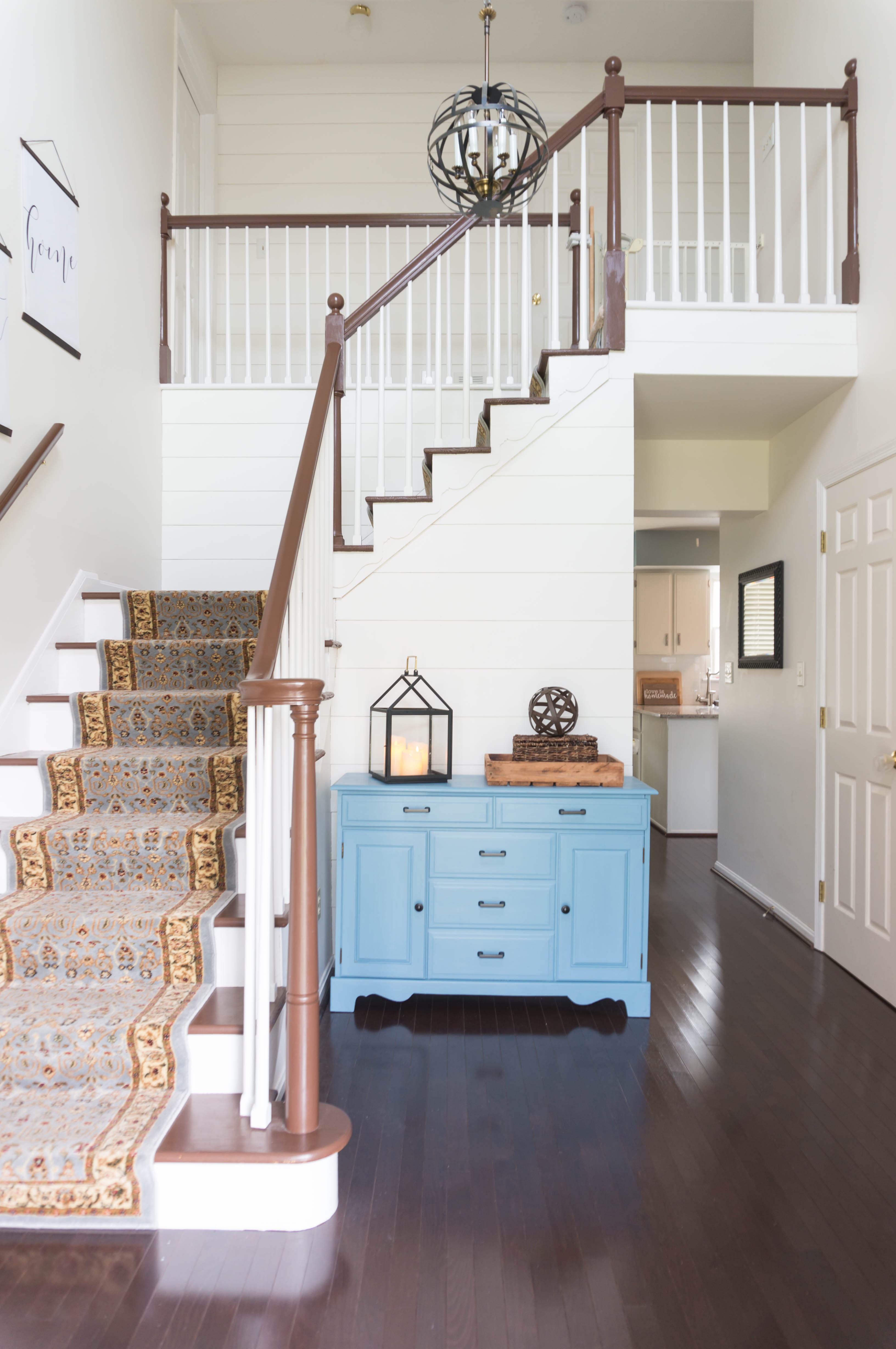 Inexpensive entry remodel reveal. Find out how our farmhouse foyer turned out. Our fixer upper foyer needed a major redo. See how we rennovated our foyer on a budget. #farmhousedecor #farmhouse #fixerupper #foyer #entryway