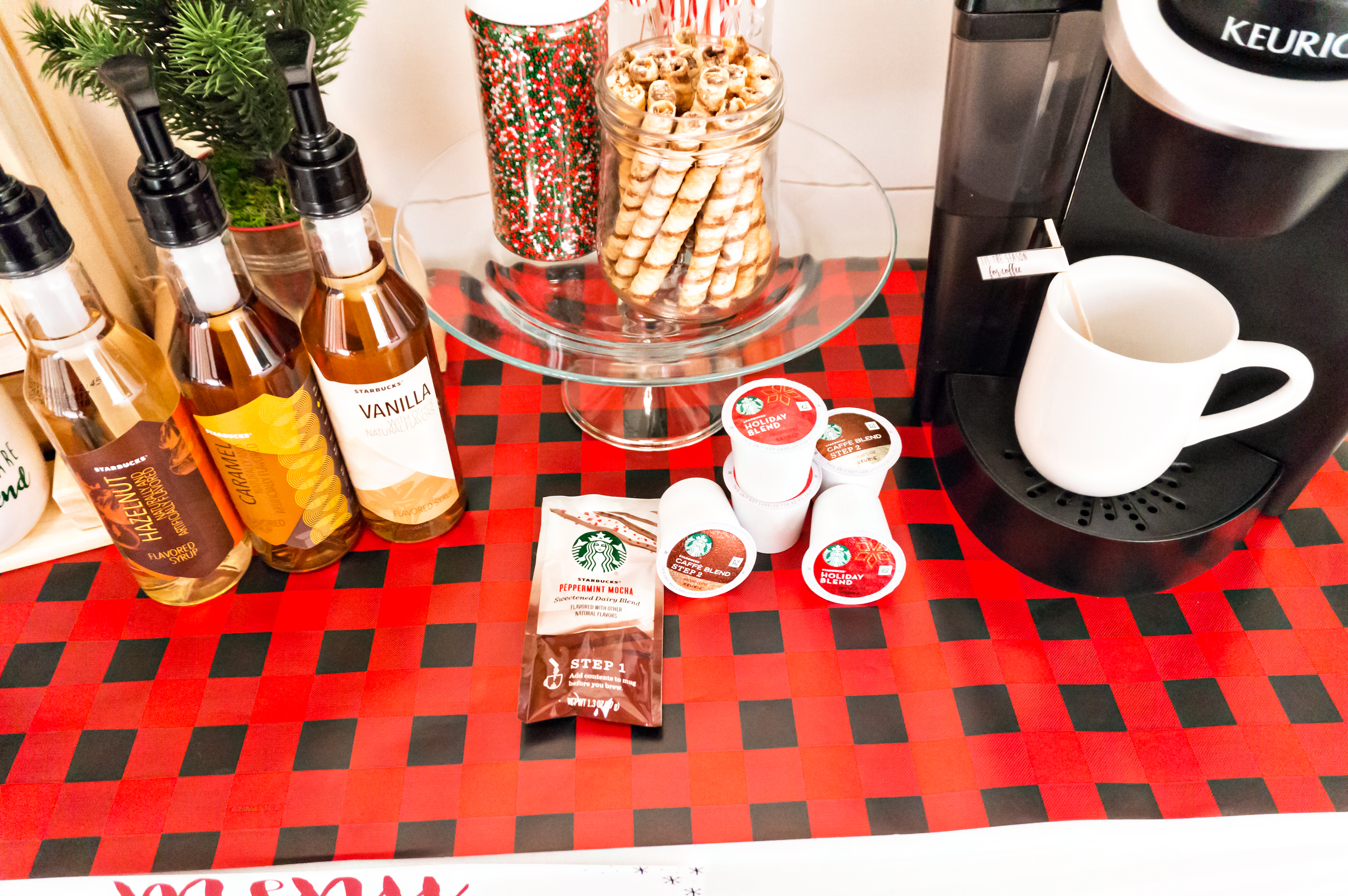 #ad How to Create a Coffee Bar with Starbucks®. Learn some tips and tricks for setting up a holiday coffee bar. Learn how to make a festive party space this Christmas. Free printables included - holiday coffee banner, free coffee gift tag, free Christmas coffee planner stickers, and more. #SavorHolidayFlavors #starbucks #freebies #christmas #coffeebar #plannerstickers