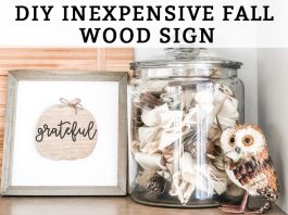 DIY Inexpensive Fall Wood Sign This DIY inexpensive fall wood sign is picture. It's an image of a wood sign with a light wood frame, white background, wood pumpkin, and the words grateful written in black cursive across the pumpkin. A small twine bow is on the stem of the pumpkin. The words, DIY Inexpensive Fall Wood Sign are on the top of the sign.