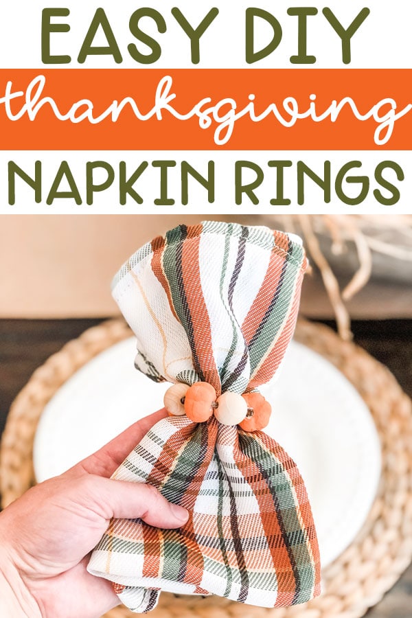 At the top of the image, it says: Easy DIY Thanksgiving napkin rings. Underneath, there is an image of the napkin ring. The image is of DIY Thanksgiving napkin rings. They're plaid green, orange, and white napkins with mini pumpkins and wood beads around the napkins.