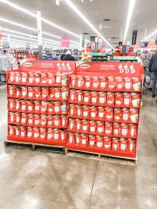 #shop Command™ hook display in walmart. The display is a red cardboard display full of clips, hooks, and strips.