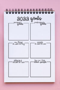 This image shows a printed copy of the 2022 goal worksheet that is available for free at the end of this blog post.