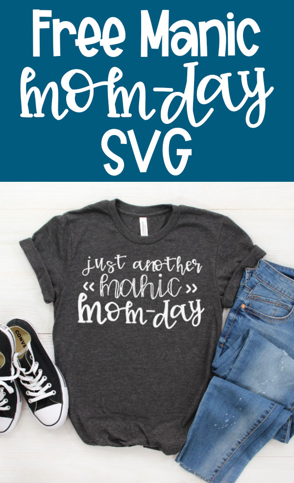 Free Manic Mom Day SVG is on the top in white text on a medium blue background. To the bottom is an image of a gray t-shirt with the words, Just another Manic Mom-Day. Next to a pair of blue jeans and black converse sneakers.