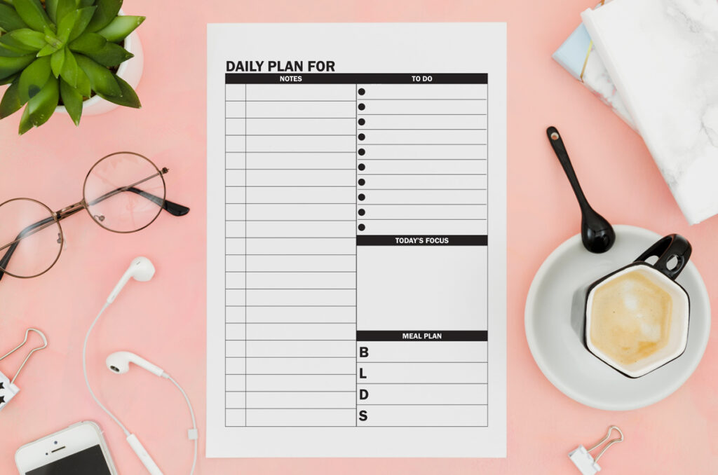 This image shows the free daily planner printable that you can download at the end of this blog post. There are two free daily planner options. This photo shows one of the two, it shows the one with a notes section.