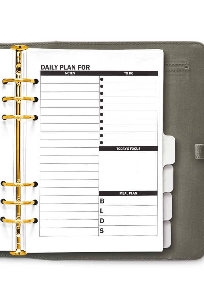 This image shows the free daily planner printable that you can download at the end of this blog post. There are two free daily planner options. This photo shows one of the two, it shows the one with a notes section.