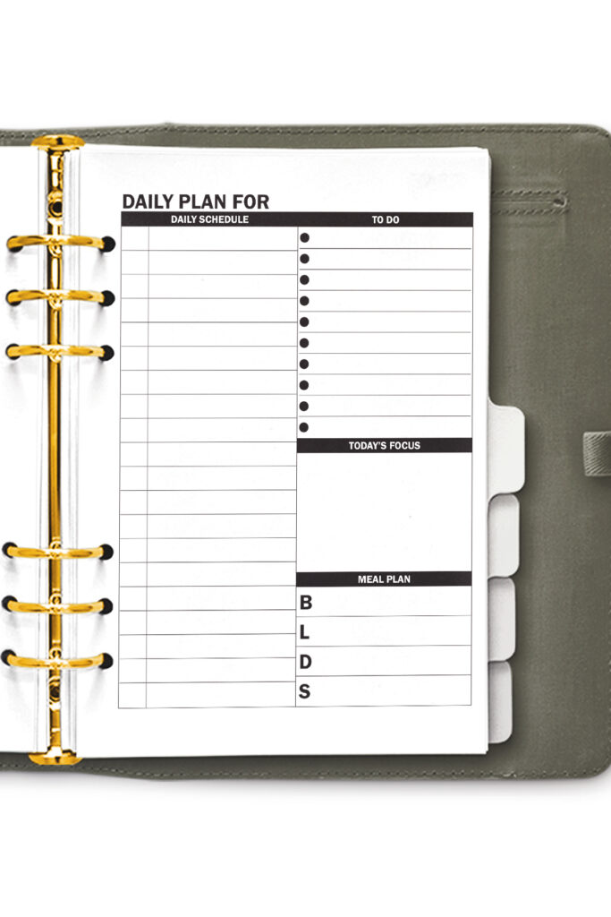 This image shows the free daily planner printable that you can download at the end of this blog post. There are two free daily planner options. This photo shows one of the two, it shows the one with a schedule section.
