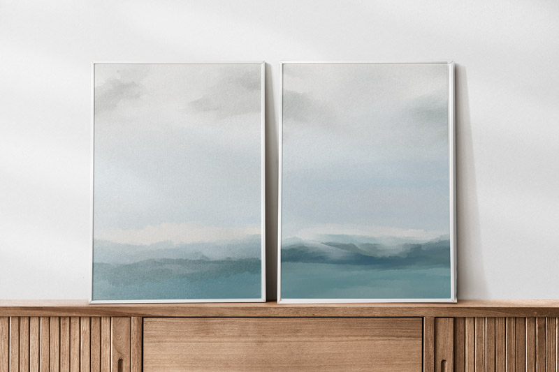 This is the image shows the two free abstract wall art prints you can download for free in this blog post. It shows you the prints above a console table.