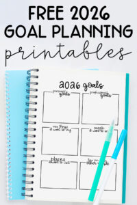 Pinterest graphic titled &ldquo;Free 2026 Goal Planning Printables,&rdquo; showing a spiral notebook open to a 2026 goals worksheet with pens resting on the page and a bright blue notebook underneath.