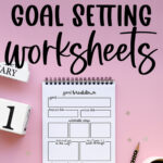 Graphic with the text “Free 2026 Goal Setting Worksheets” above a spiral notebook displaying a detailed goal breakdown page on a pink background with a pencil, coffee cup, and decorative number blocks.