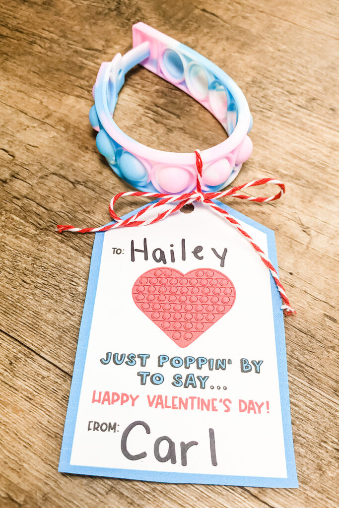 This image shows the Pop-it Valentine Printable available to download at the end of this post. This image is showing one of the two free pop-it valentines you can download - the gift tag version.