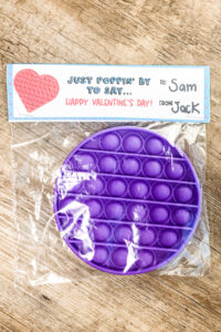 This image shows the Pop-it Valentine Printable available to download at the end of this post. This image is showing one of the two free pop-it valentines you can download - the baggie cover.