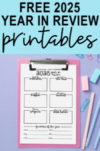 Graphic with the heading &ldquo;Free 2025 Year in Review Printables&rdquo; above a 2025 year-in-review worksheet displayed on a pink clipboard with pastel pens, paper clips, and erasers on a lavender background.