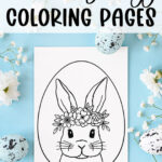 This image shows one of the Easter Egg coloring pages designs you can download for free at the end of this blog post. This image shows a cute bunny with a floral headband in an easter egg on a coloring page. It is on a blue background surrounded by flowers and Easter eggs. There is also text at the top that says 60 free Easter egg coloring pages.