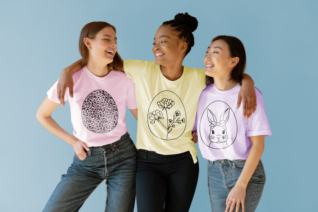 This image shows 3 of the free Easter egg SVGs you can download at the end of this blog post. The image shows three women wearing the black and white version of the free design.
