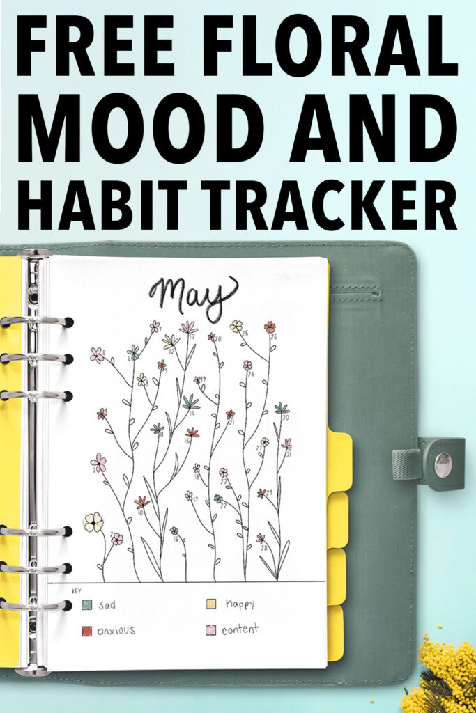 The top of this image says Free Floral Mood and Habit Tracker. Below that is a blue-green planner with silver rings opened up to the free May Mood tracker you can download at the end of this blog post. The tracker is filled in with various colors. There is a Key at the bottom of the tracker that says - blue for sad, reddish orange for anxious, yellow for happy and pink for content.