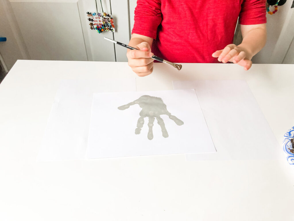 This image shows the result of the child's gray handprint.