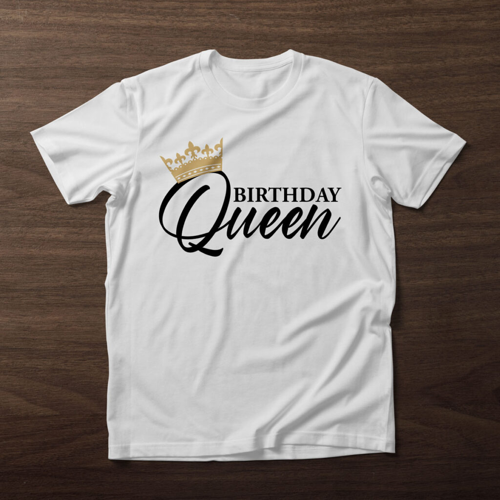 This image shows one of the free birthday SVG files you can get in this blog post. It shows a white t-shirt on a wood background. On the shirt, it has the birthday queen SVG.