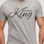 This image shows an example with one of the free svgs you can get in this blog post. It shows a man wearing a gray shirt with one of the free svgs, Birthday King.