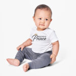 This image shows an example with one of the free svgs you can get in this blog post. It shows a little boy wearing a white onesie with one of the free svgs, Birthday Prince.