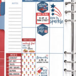 This image shows an example of the Fourth of July planner stickers in a planner. The planner has a red cover and is open to the left side of the week of July 4th. The background behind then planner is blue with red, white, and blue paper confetti stars.