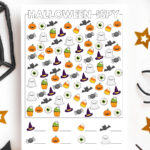 This is an image of one of the free printable Halloween i spy worksheets you can download for free at the end of this blog post. It is surrounded by a few gold stars, part of a black web, and some fake spider legs.