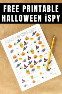 At the top the image says Free Halloween I Spy Printables. This is an image of the free Halloween I spy in the color, easier design. It is laying on brown Kraft paper with a small fake orange pumpkin in the top corner and a pencil laying on top of the worksheet. You can download this and three other free Halloween i Spy worksheet options.