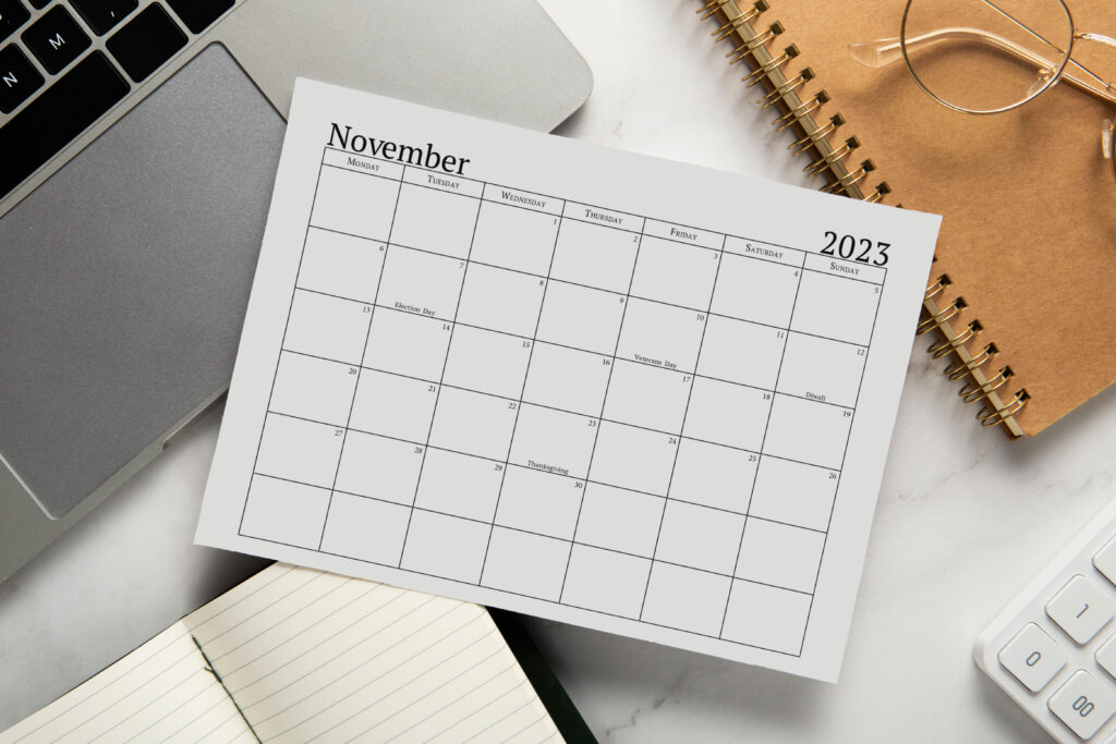 This image shows a 2023 printable calendar one page design. This is an example of a portion of the 2023 yearly calendar you can get for free at the end of this post. This is showing the month of November 2023 in a simple black text with holidays.