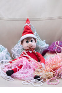 If you are a knitter, this is a super quick elf on the shelf set up. The elf is covered with yarn. You could do this with other things, too! This is just one of 50+ Elf on the Shelf ideas for home. There are tons of easy ideas, funny ideas, last minute ideas, and more. Plus, you’ll get a set of free Elf on the Shelf planning printables. This includes a blank elf on the shelf calendar, list of elf on the shelf ideas, printable elf on the shelf notes, a fillable elf on the shelf note set, and more.