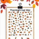 This image shows one of the free I Spy Thanksgiving printables you can grab for free at the end of this post. At the top, the image has leaves and pumpkins. Below that is a clipboard with the colorful, harder Thanksgiving iSpy worksheet.