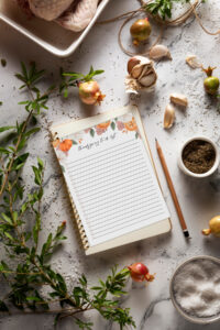 This image shows the free Thanksgiving list you can get as part of the Thanksgiving shopping list printable, to do lists, and menu planner set at the end of this blog post. This image shows the to do list surrounded by some cooking ingredients and a pencil.