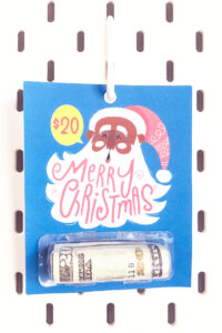 This shows one of the Christmas chapstick money holder card that you can get for free at the end of this blog post. This example is the Santa money gift card.