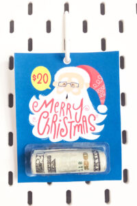This shows one of the Christmas chapstick money holder card that you can get for free at the end of this blog post. This example is the Santa money gift card.