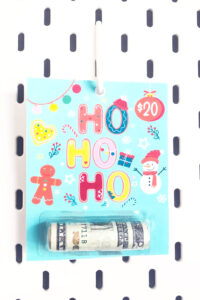 This shows one of the Christmas chapstick money holder card that you can get for free at the end of this blog post. This example is the Ho Ho Ho vintage color money gift card.