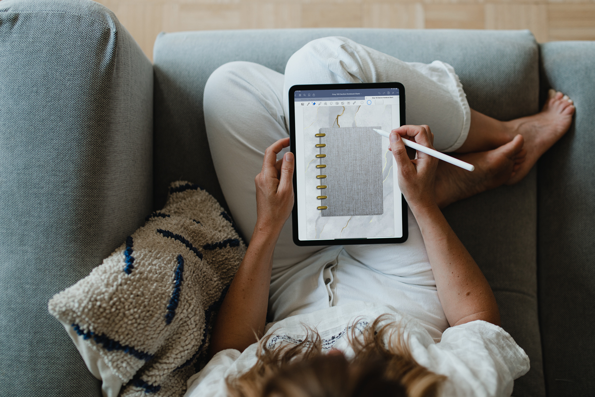 This image shows a person using the gray version of the digital notebook.