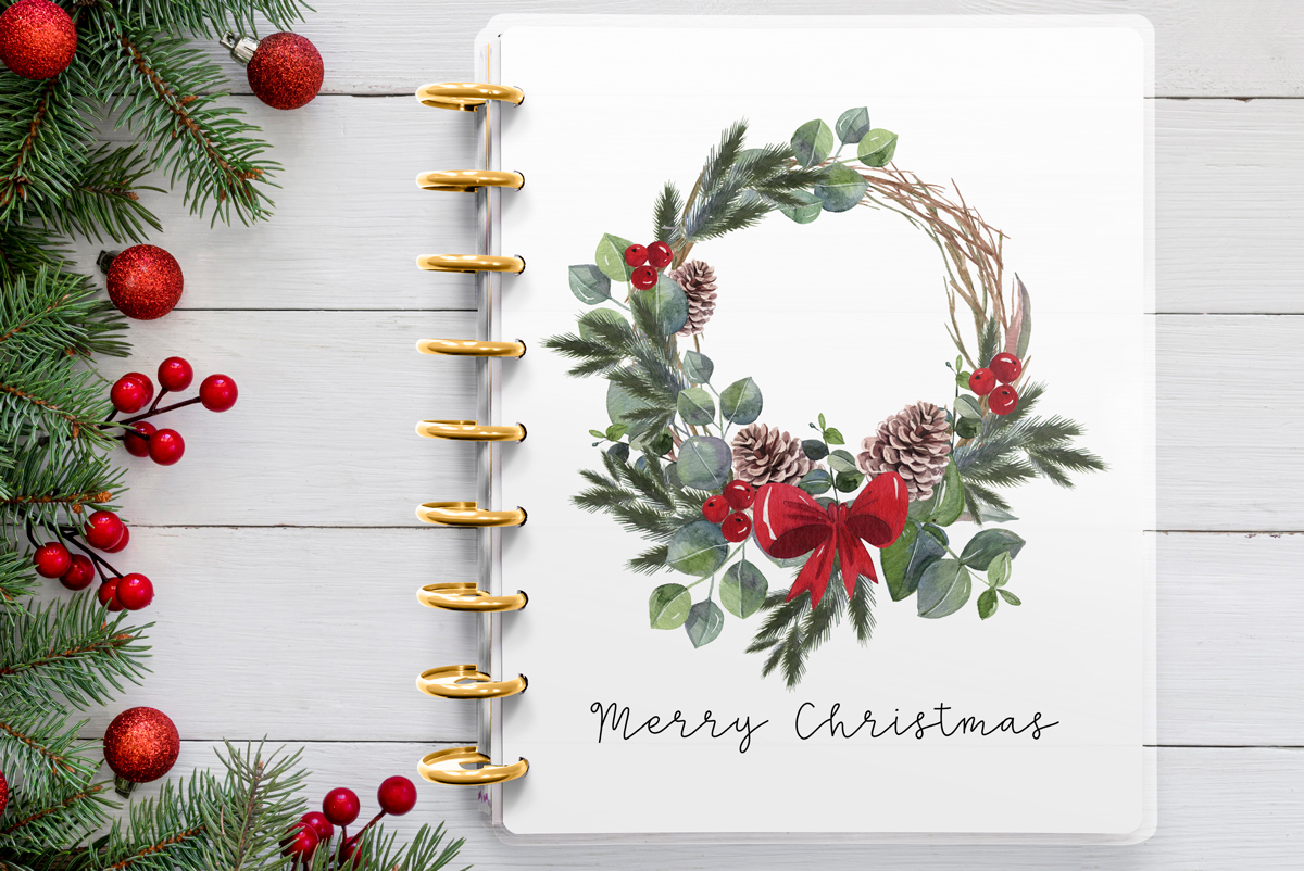 This image shows one of the designs you can get in this free Merry Christmas planner cover and inserts set. It has a Christmas wreath on it.