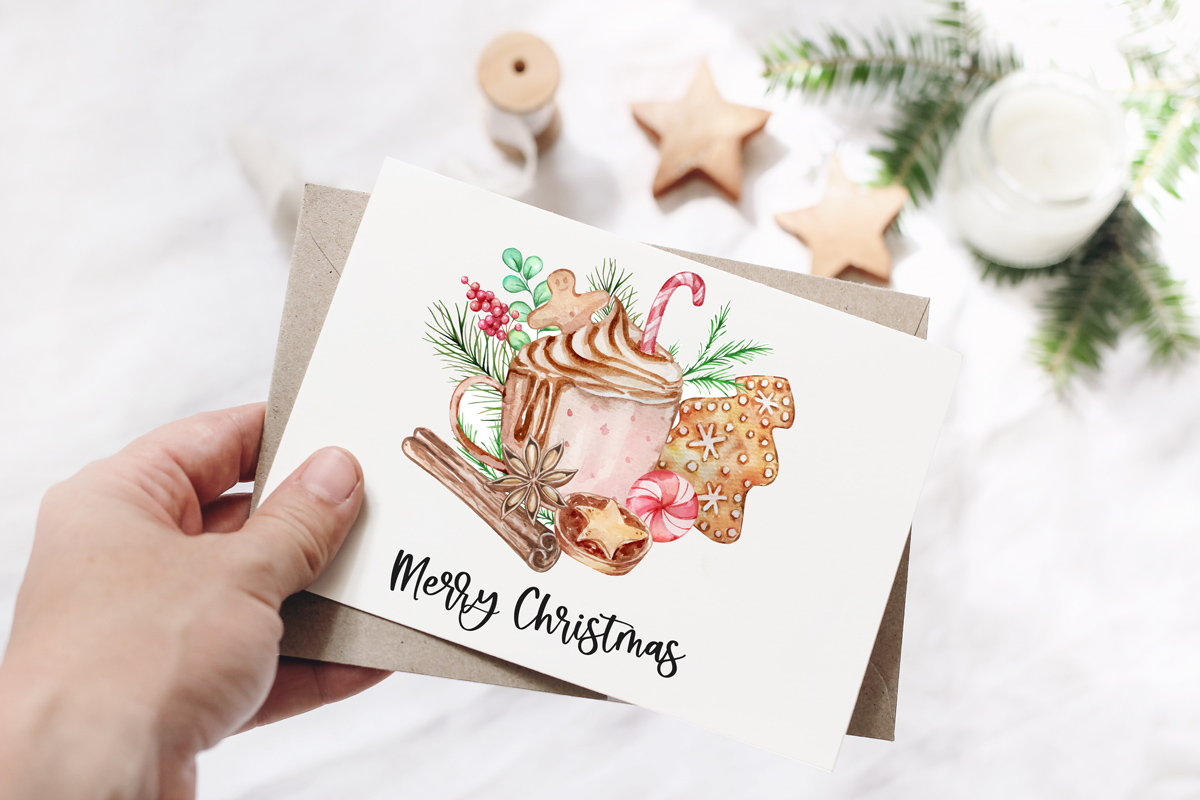 This image shows one of the designs you can get in this free Merry Christmas printable set of cards and prints. It says Merry Christmas on it and has a picture of hot chocolate and Christmas treats.