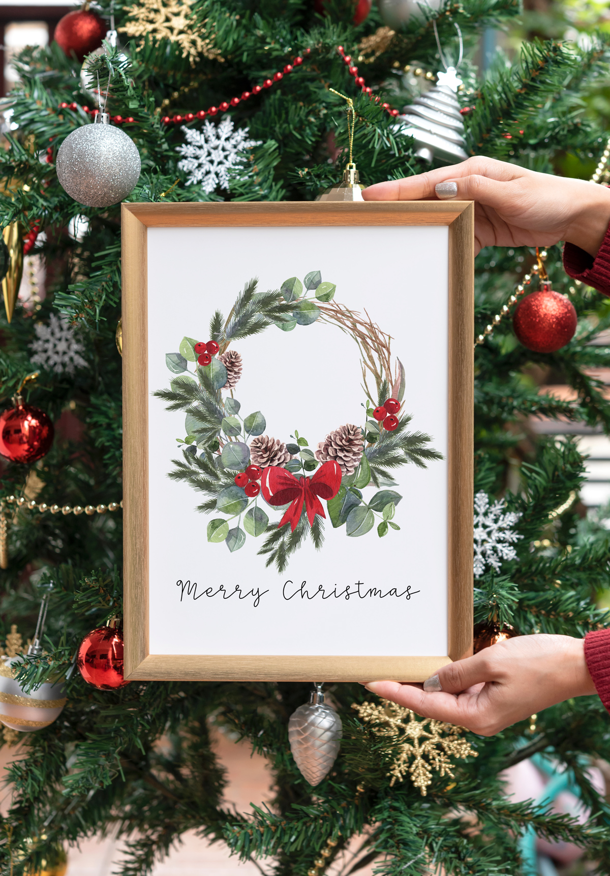 This image shows one of the designs you can get in this free Merry Christmas printable set of cards and prints. It says Merry Christmas on it and has a picture of a Christmas wreath.