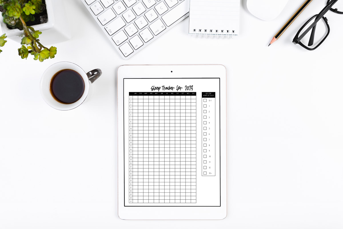 This image shows the sleep tracker printable you can get for free at the end of this blog post. This is showing the yearly version of the sleep log being used in an ipad.