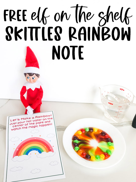 At the top, the image says free elf on the self skittles rainbow note. Below that the image shows the Elf on the Shelf skittles rainbow printable that you can get for free at the end of this blog post. The Elf on the Shelf is sitting with a plate of skittles, the free printable skittles magic note and a measuring cup of water.