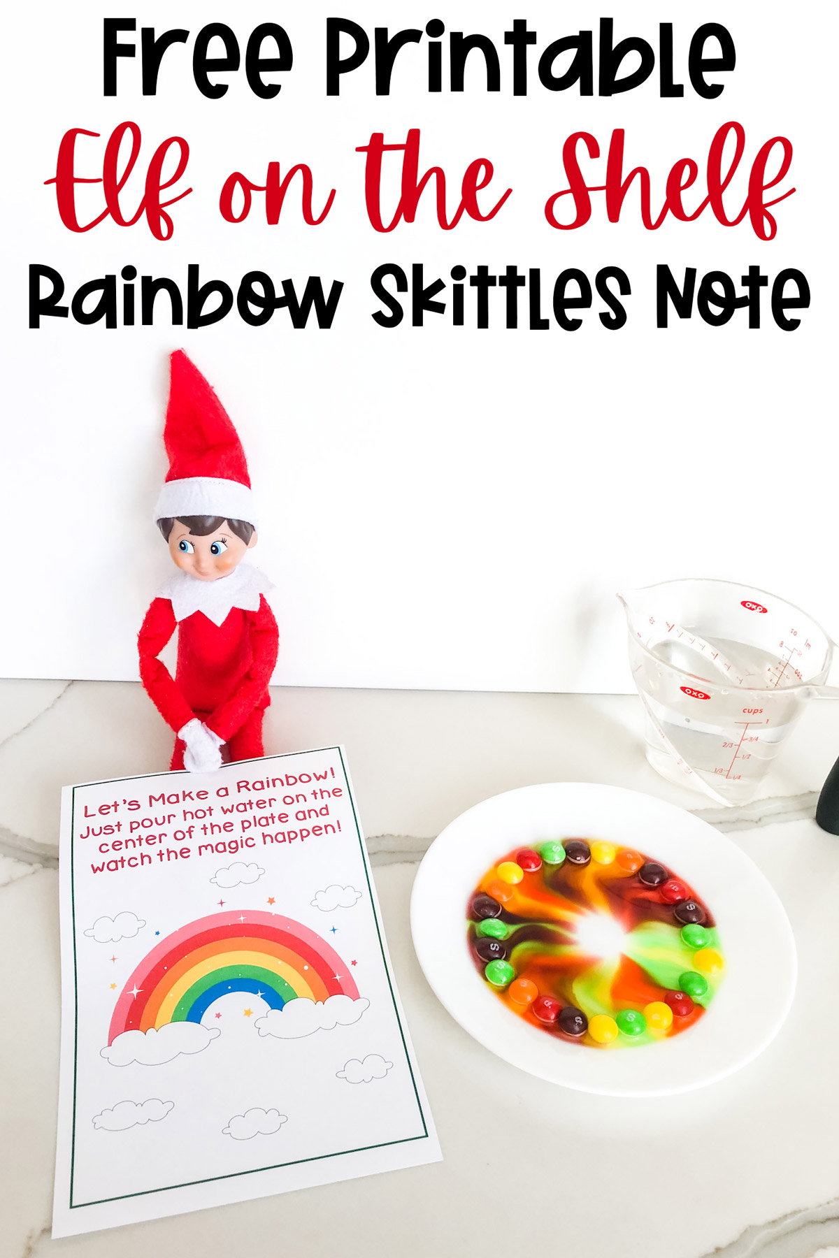 At the top, the image says free printable elf on the self rainbow skittles note. Below that the image shows the Elf on the Shelf skittles rainbow printable that you can get for free at the end of this blog post. The Elf on the Shelf is sitting with a plate of skittles, the free printable skittles magic note and a measuring cup of water.