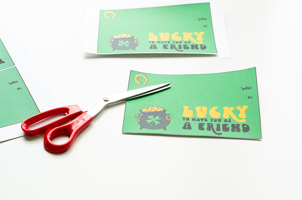 This image shows cutting out the lucky to have you gift tags. It says lucky to have you as a friend.