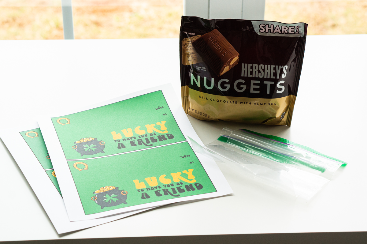 This image shows the materials needed to create the lucky to have you St. Patrick's Day gifts. The printed labels say lucky to have you as a friend.