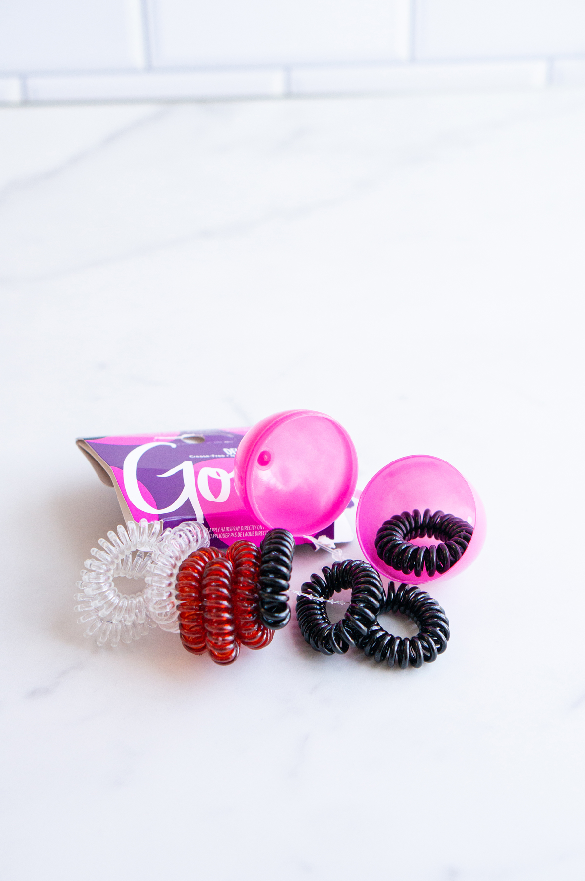 This image shows items that can fit into an Easter egg for adults, this one shows hair ties.