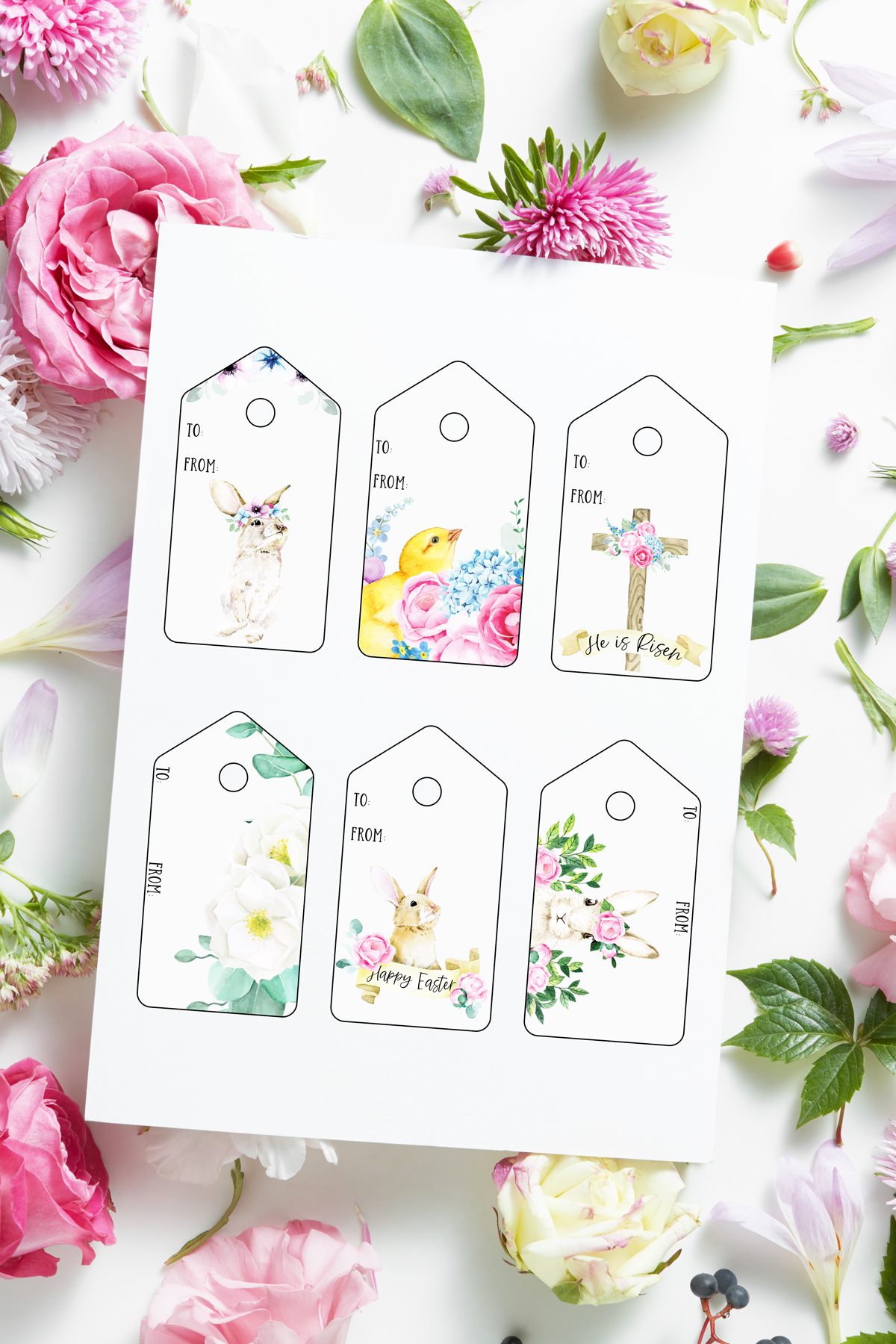 This image shows the 6 free pretty printable Easter gift tags you can download at the end of this post. They are in in a traditional pale color scheme. Each design is different - there are Easter bunny rabbits, a cross, a chick, and lots of florals. The tags are surrounded by flowers.